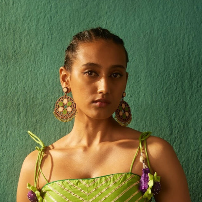 statement earring danglers in shades of green and cream to make a bold statement.