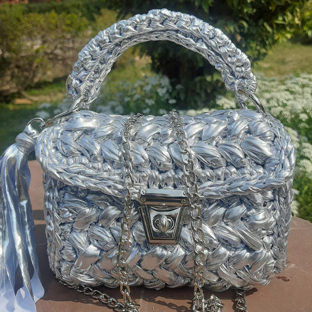 handcrafted crochet party bag with a detachable chain.