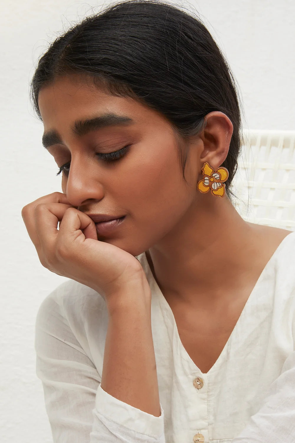 Handcrafted yellow flower studs, a stylish choice for those seeking eco-conscious jewelry.